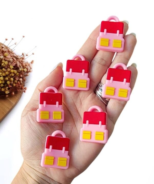 APLIQUE EMBORRACHADO MOCHILA ROSA 3CM C/ 2 UND