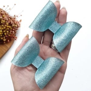APLIQUE EM ACRÍLICO LAÇO GLITTER AZUL 2X6,5X5 CM UND