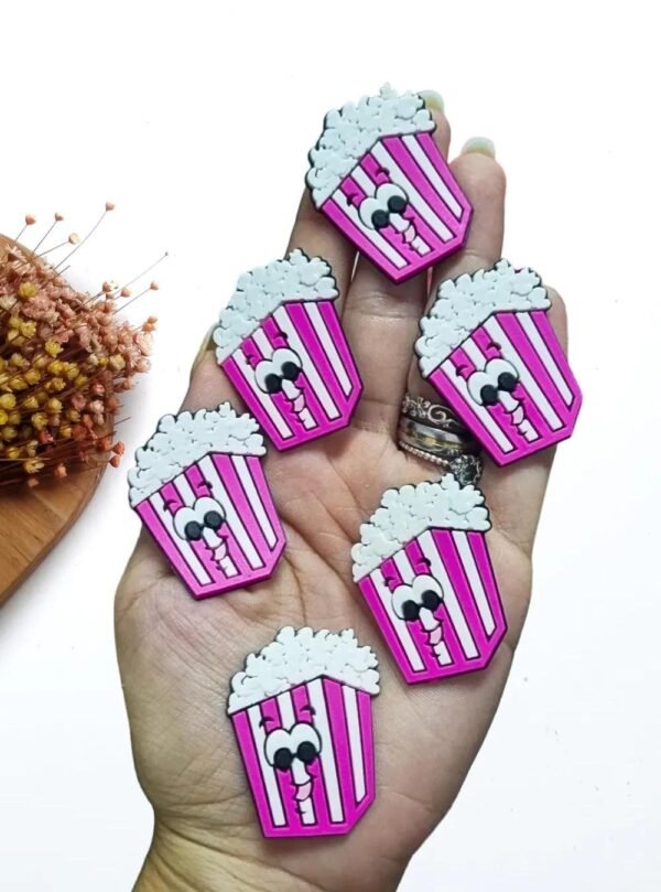 APLIQUE EMBORRACHADO SACO COM PIPOCA ROSA 3X4CM C/ 2 UND