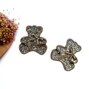 JOIA EM PLÁSTICO MINI URSINHO CRAVEJADO DE STRASS C/ LAÇO 2,4 CM C/ 2 UND