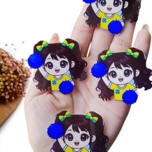 APLIQUE EM ACRÍLICO SUBLIMADO MENININHA MASCOTE DA COPA C/ POMPOM AZUL BIC 4 CM UND