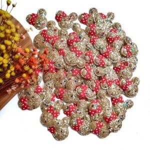 APLIQUE MINNIE EM LONITA GLITTER GROSSO DOURADO C/ LAÇO VERMELHO 3X3,5CM UND