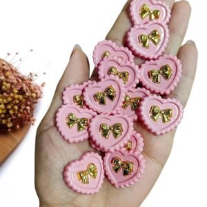 JOIA EM PLÁSTICO CORAÇÃO ROSA E LAÇO 2,8 CM C/ 2 UND